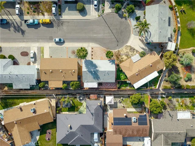 an aerial view of a house with outdoor space