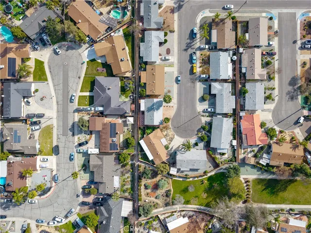 a aerial view of residential houses with outdoor space