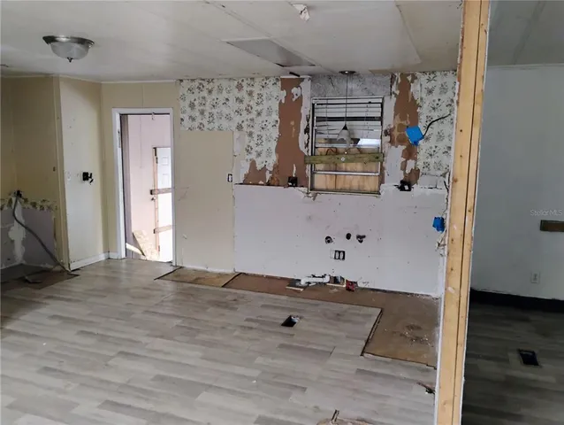 a view of a hallway with front door