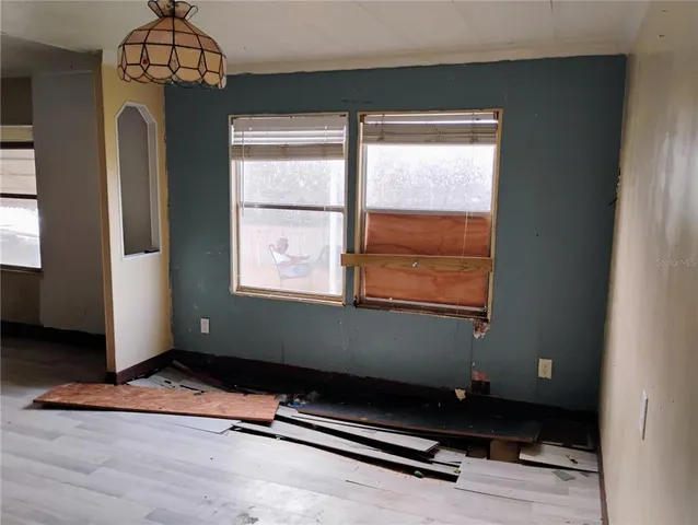 a room with gym equipment and a window