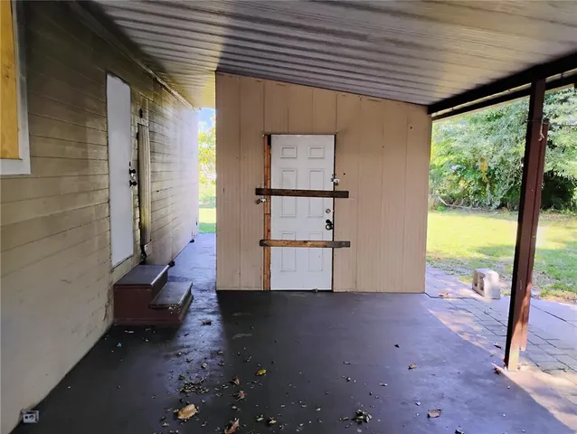 a view of a room with wooden floor and iron gate