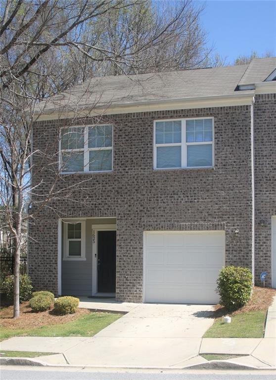 a front view of a house with a garage
