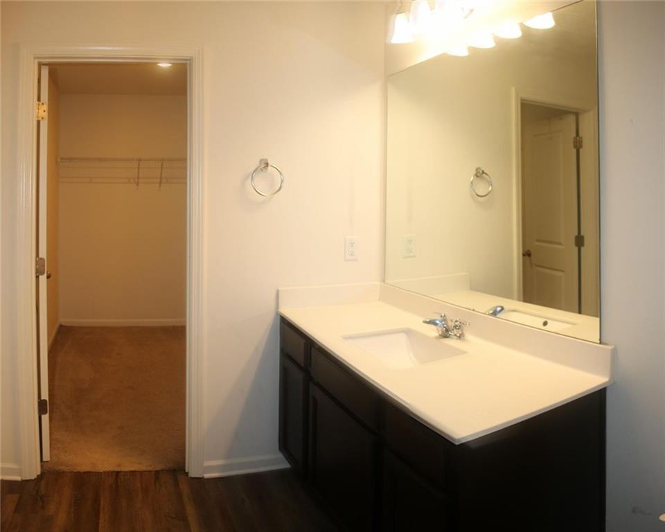 1625 Honeysuckle Path Conyers, GA 30012 - Photo 11 of 17 a bathroom with a sink and a mirror