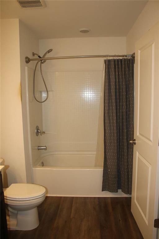1625 Honeysuckle Path Conyers, GA 30012 - Photo 12 of 17 a bathroom with a shower and a toilet