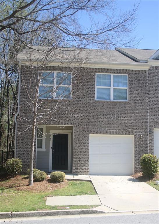1625 Honeysuckle Path Conyers, GA 30012 - Photo 2 of 17 a front view of a house with a yard