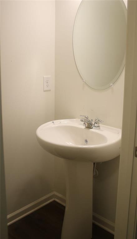 1625 Honeysuckle Path Conyers, GA 30012 - Photo 8 of 17 a bathroom with a sink and a mirror