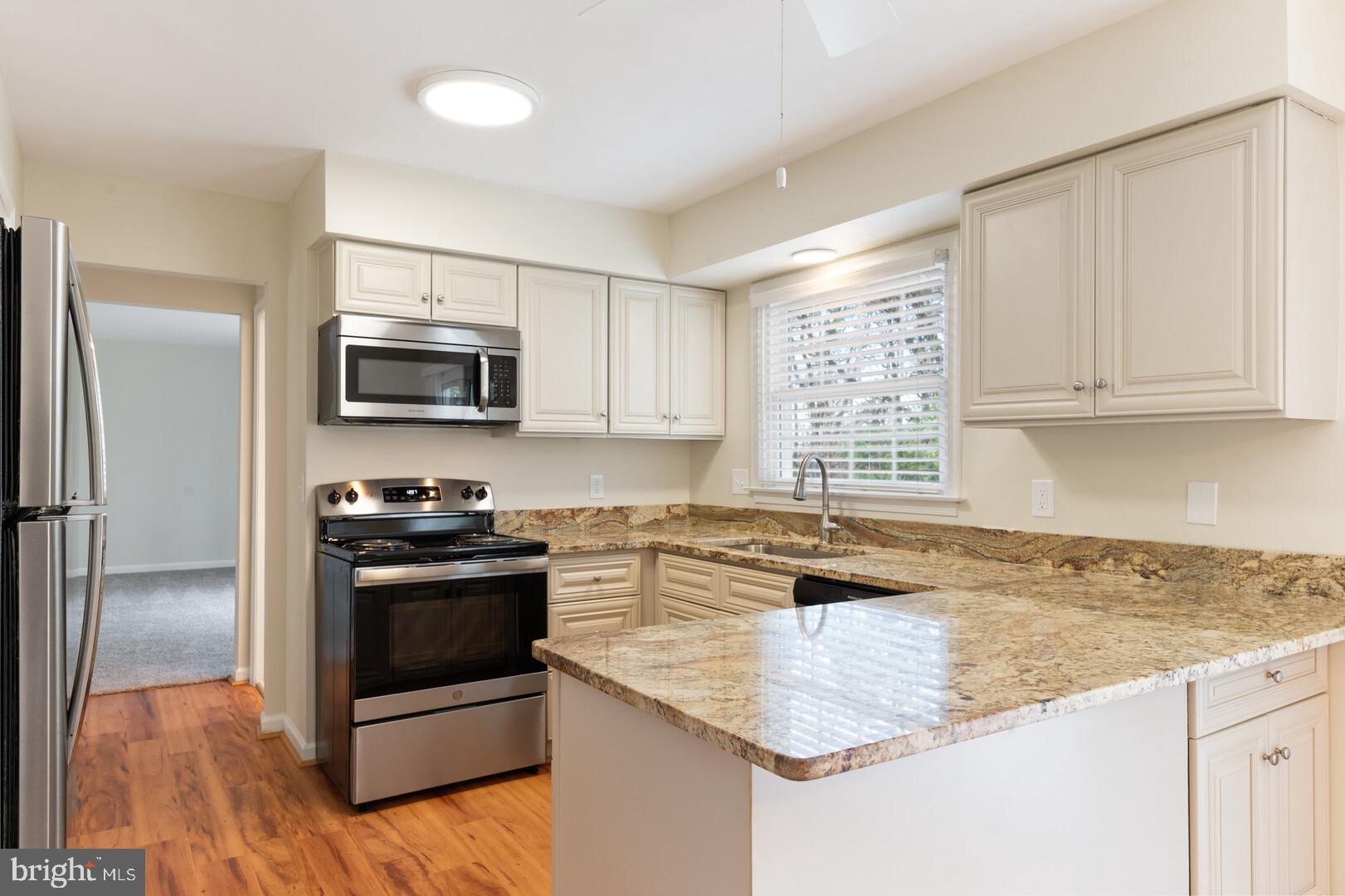 157 Peyton Road Sterling, VA 20165 - Photo 12 of 46 Updated cabinetry and lovely window over the sink
