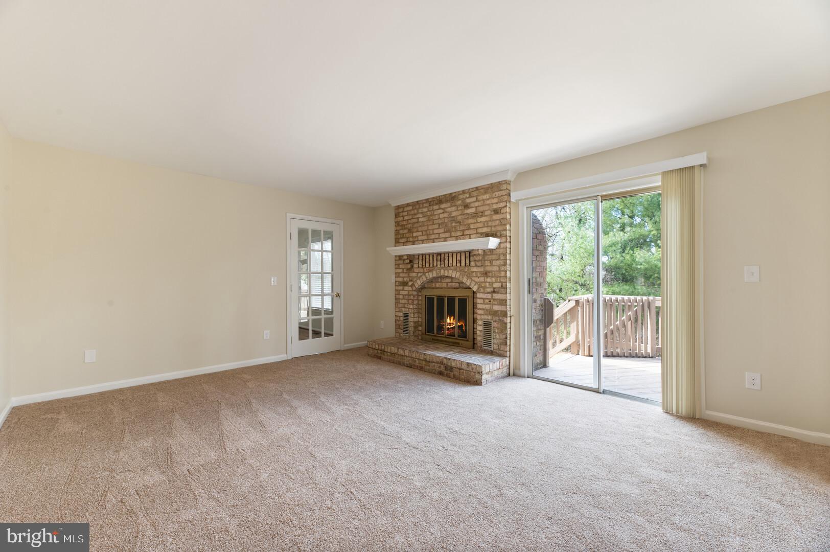 157 Peyton Road Sterling, VA 20165 - Photo 8 of 46 Family room with fire place and new carpet.