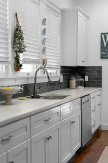 a kitchen with appliances cabinets and a sink