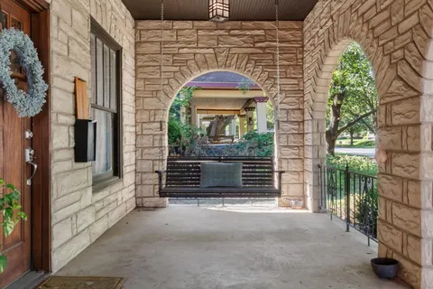 a view of front door of house with stairs