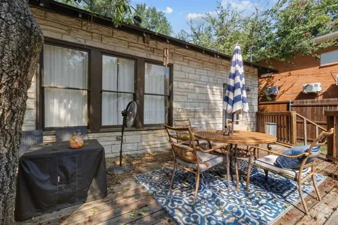 a house view with swimming pool in front of it