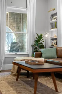 a table with a potted plant on a table and a potted plant