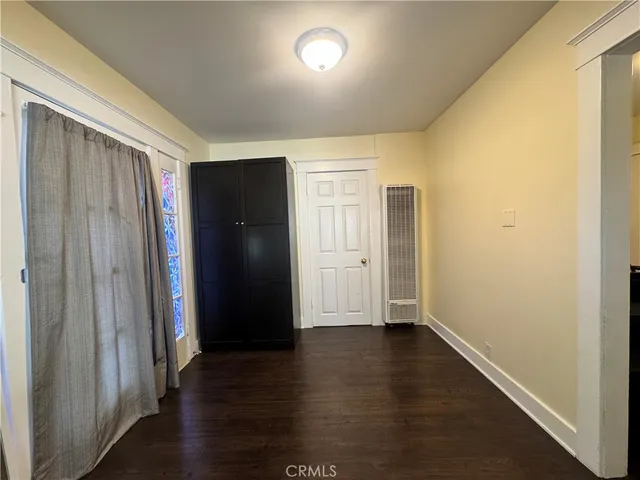 a view of hallway with wooden floor