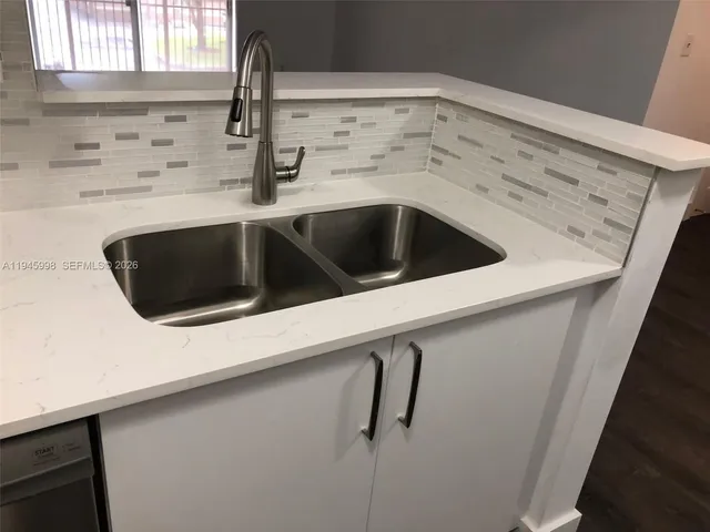 a close view of a sink and a window