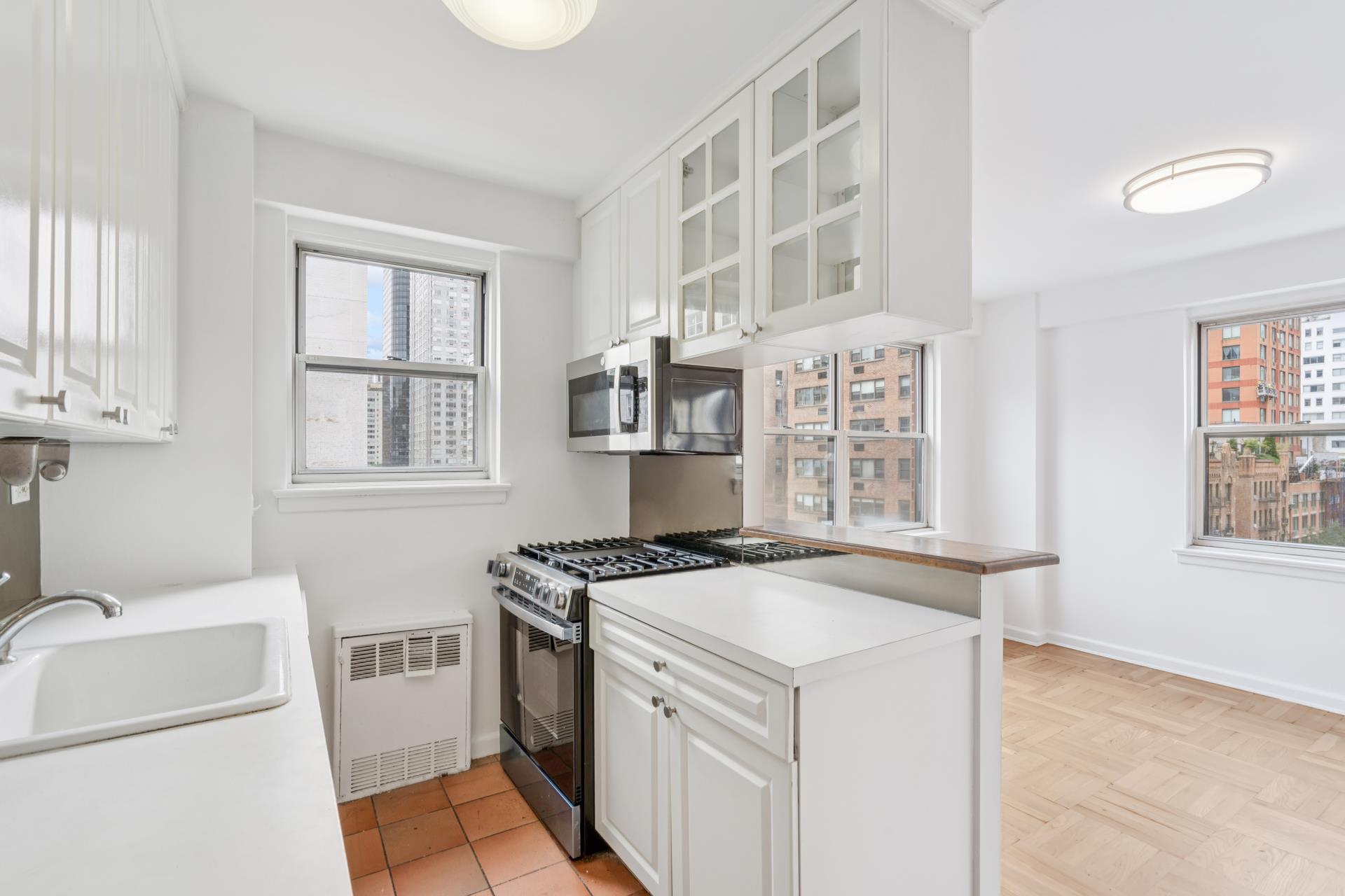 300 East 71st Street, Unit 9G Manhattan, NY 10021 - Photo 7 of 17 a view of kitchen and window