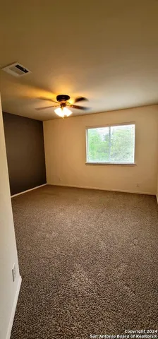 a bathroom with a sink a mirror and a shower