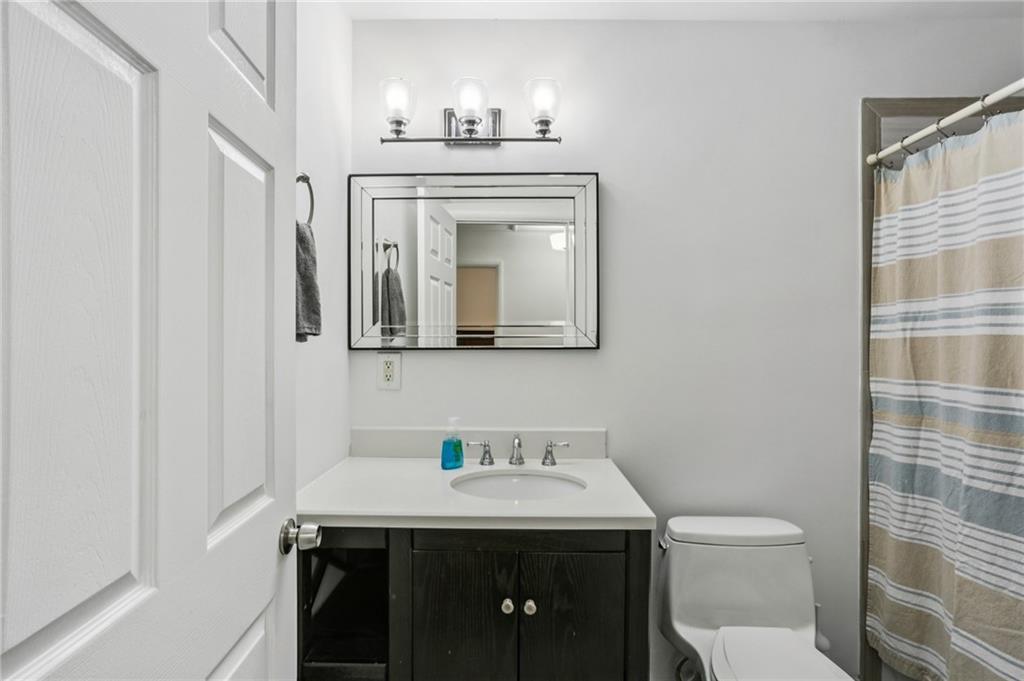 2740 Frontier Trail Atlanta, GA 30341 - Photo 21 of 29 a bathroom with a sink a toilet and mirror