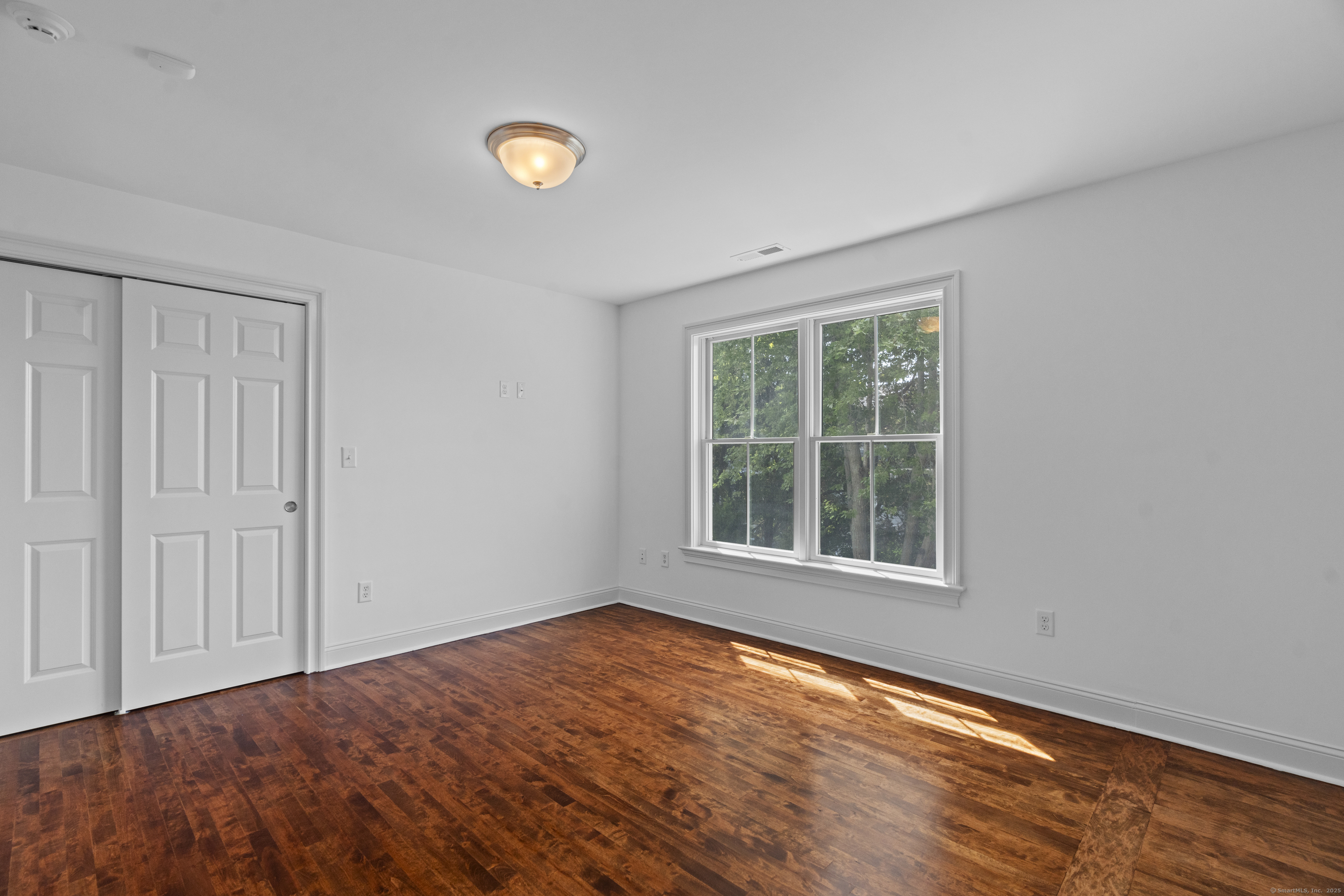 64 Webster Point Road Madison, CT 06443 - Photo 26 of 36 an empty room with a window