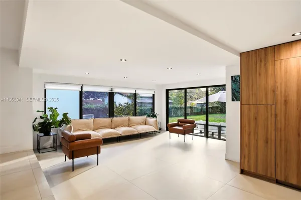 a kitchen with stainless steel appliances a stove microwave and sink