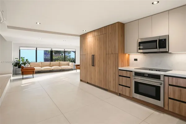 a large kitchen with a large window
