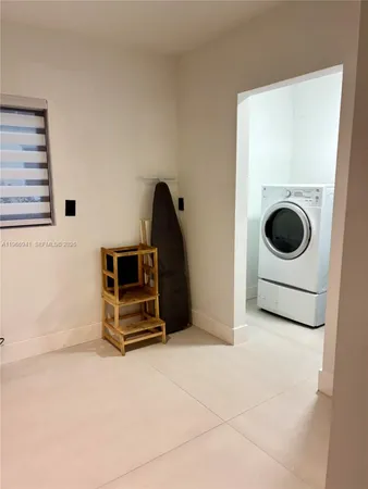 a spacious bedroom with a bed and a couch