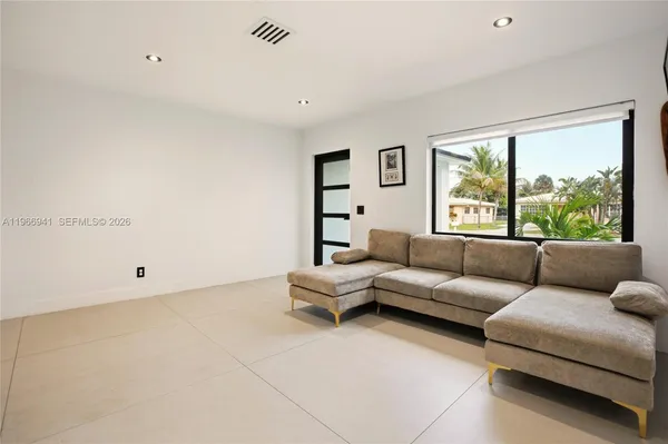 a living room with furniture and a area