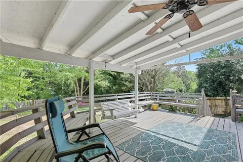 a view of back yard with outdoor seating