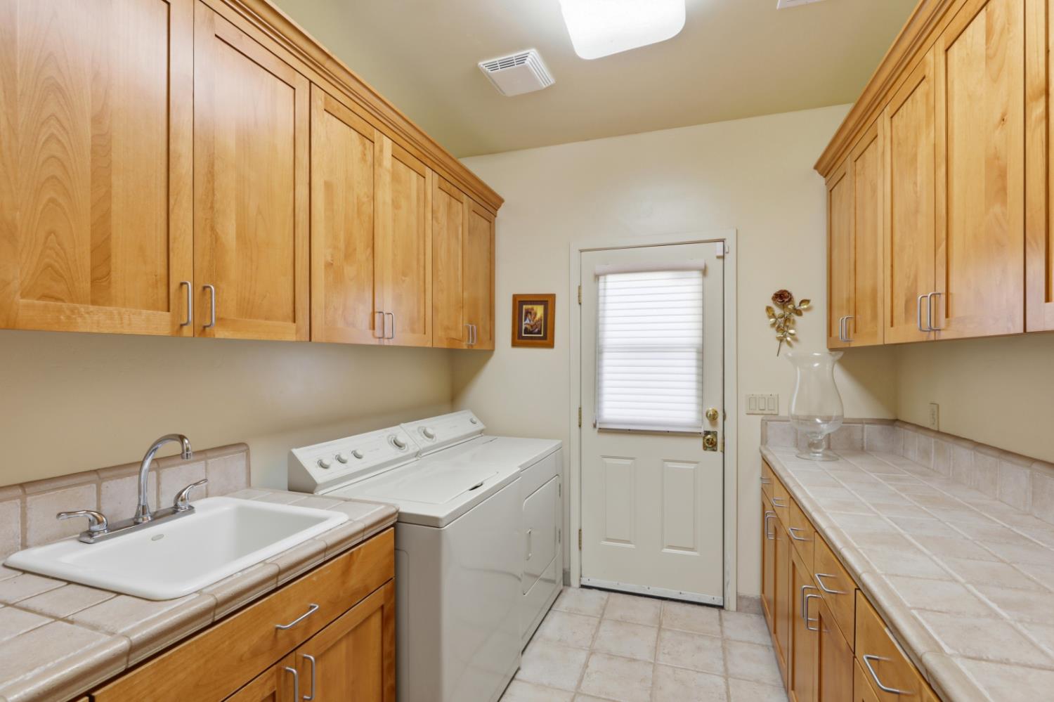 6840 Gallagher Road Pilot Hill, CA 95664 - Photo 28 of 45 Plenty of storage space in the laundry room. Washer and dryer are included.