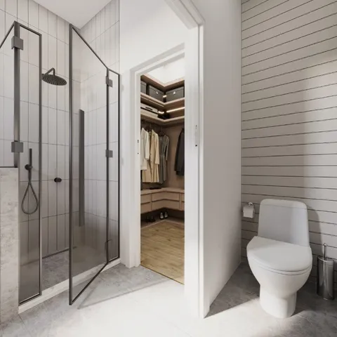 a bathroom with a toilet and a shower