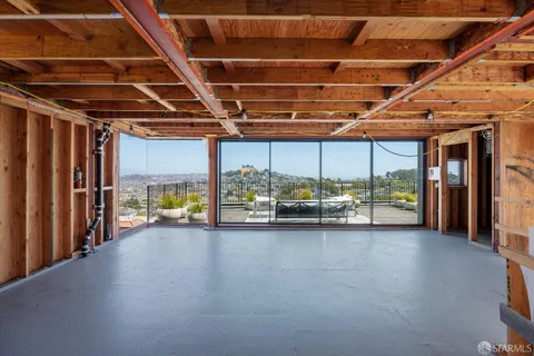 a living room with furniture a bathtub and a shower