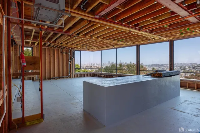 a view of a water heater room with a roof deck