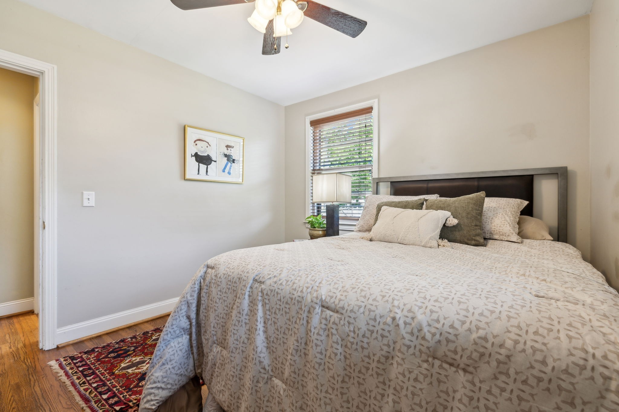 4202 Murphy Road Nashville, TN 37209 - Photo 14 of 34 a bedroom with a bed and a window