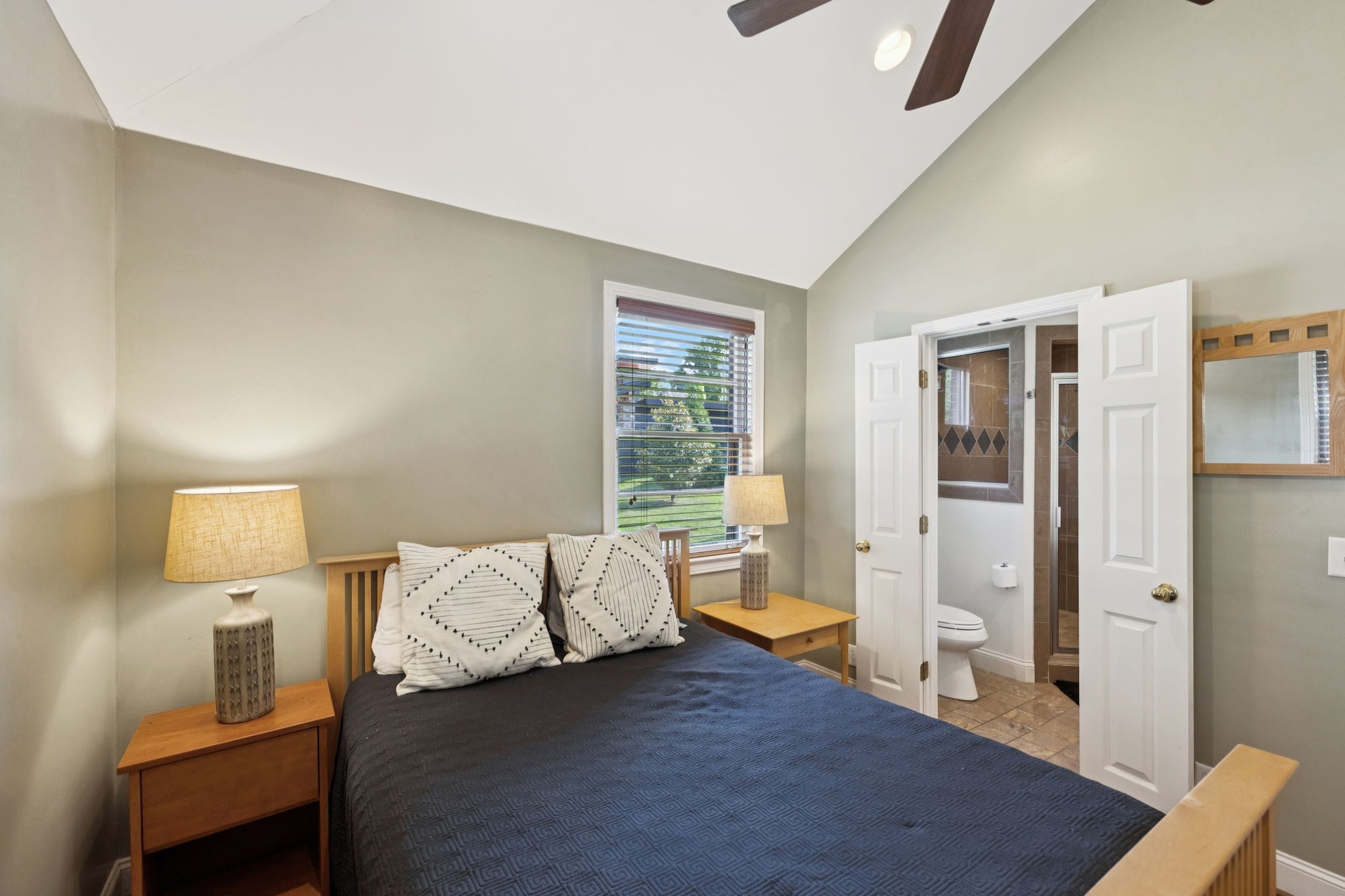 4202 Murphy Road Nashville, TN 37209 - Photo 26 of 34 a spacious bedroom with a bed and wooden floor