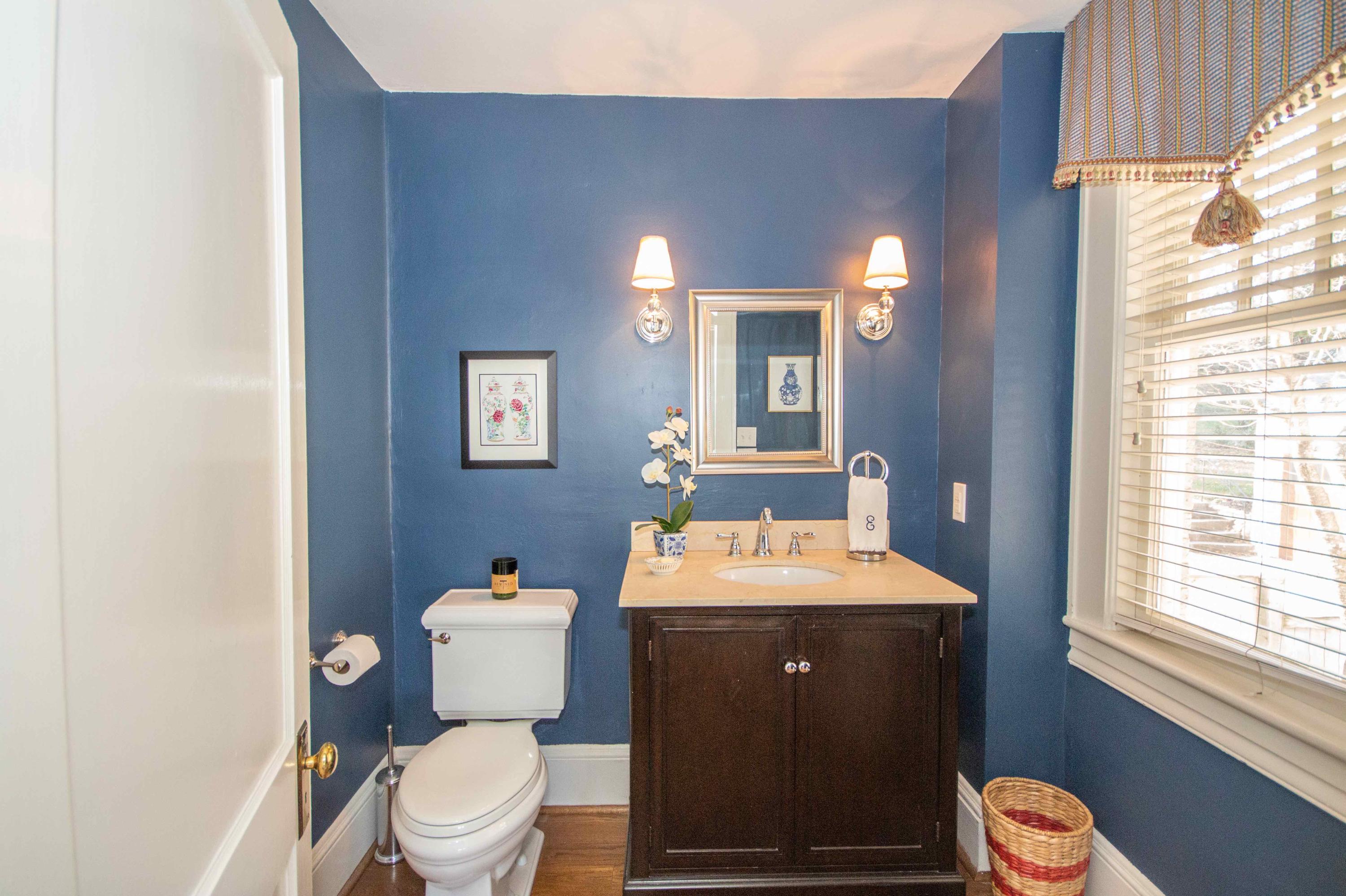 2743 Richelieu Avenue Southwest Roanoke, VA 24014 - Photo 24 of 54 a bathroom with a toilet a sink and mirror