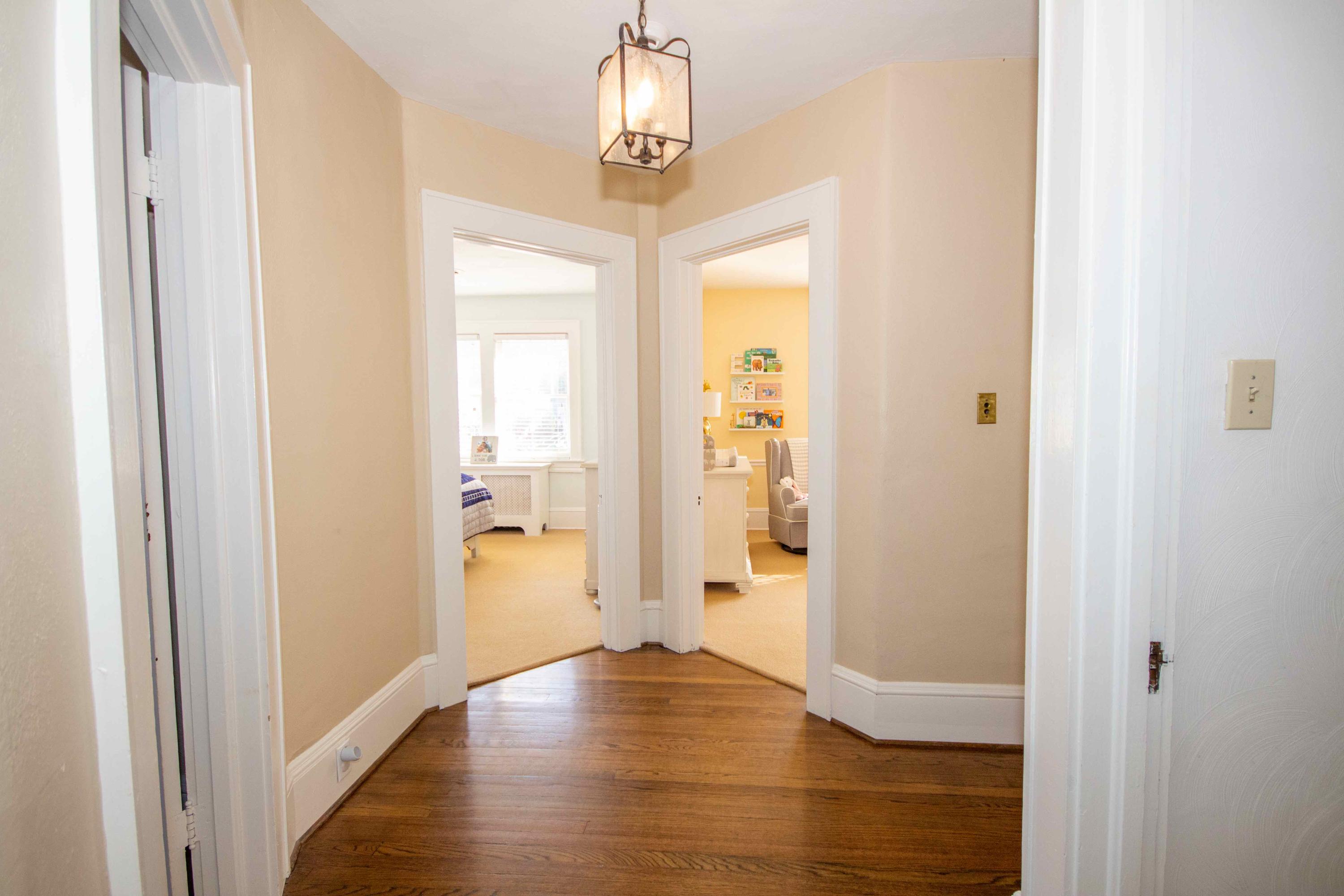 2743 Richelieu Avenue Southwest Roanoke, VA 24014 - Photo 31 of 54 a view of a hallway with wooden floor and a livingroom