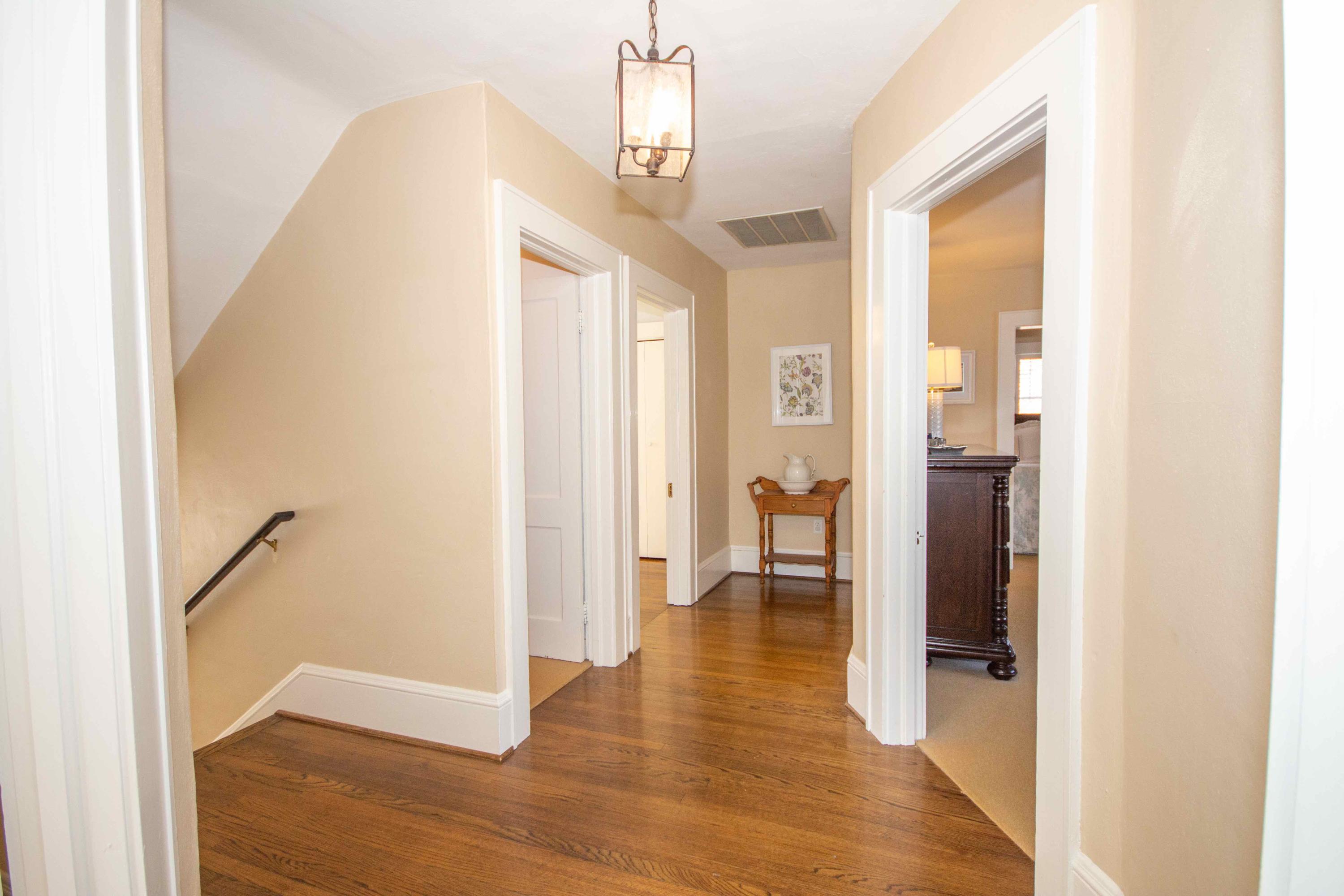 2743 Richelieu Avenue Southwest Roanoke, VA 24014 - Photo 38 of 54 a view of a hallway with wooden floor and staircase