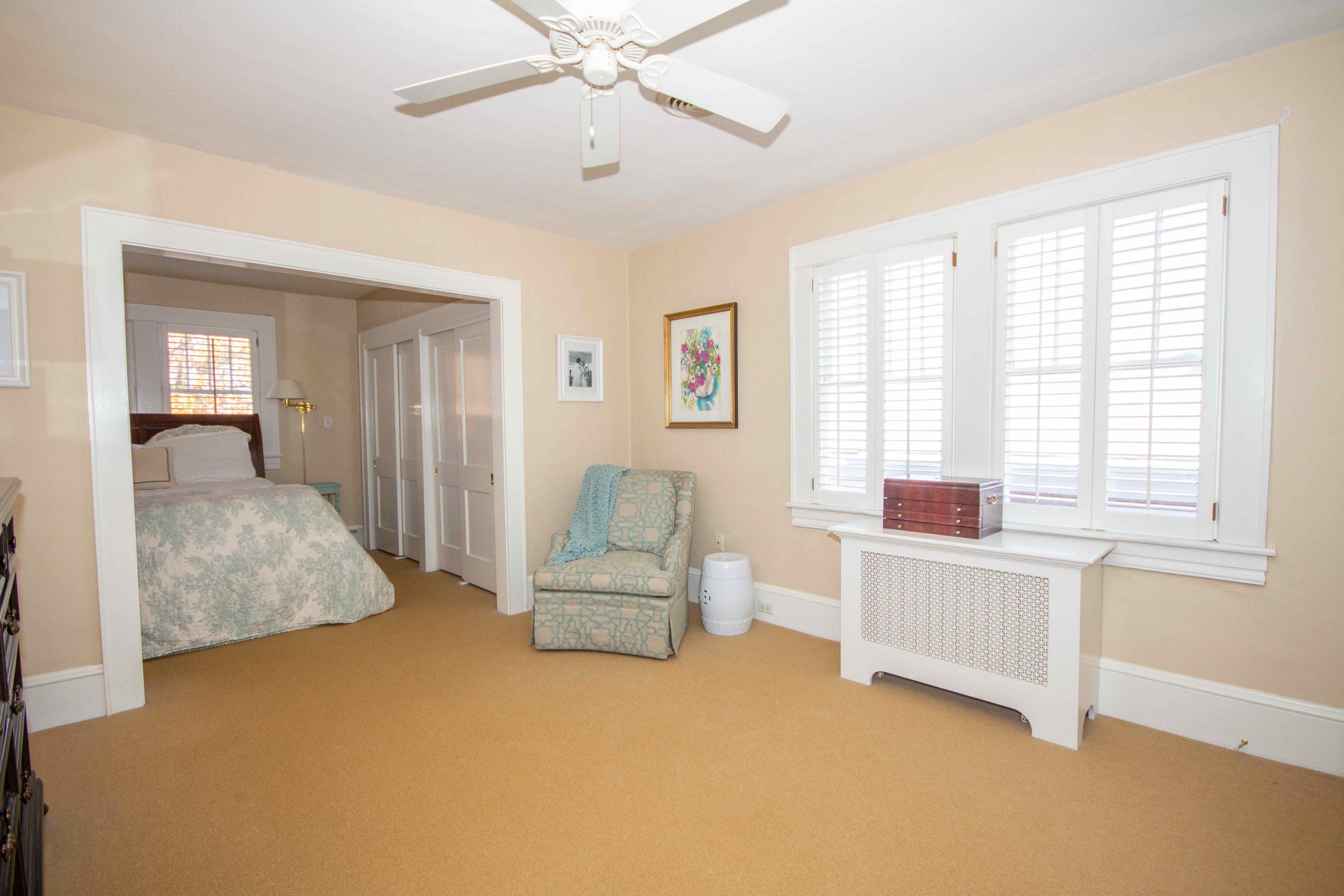 2743 Richelieu Avenue Southwest Roanoke, VA 24014 - Photo 39 of 54 a spacious bedroom with a bed and a chandelier