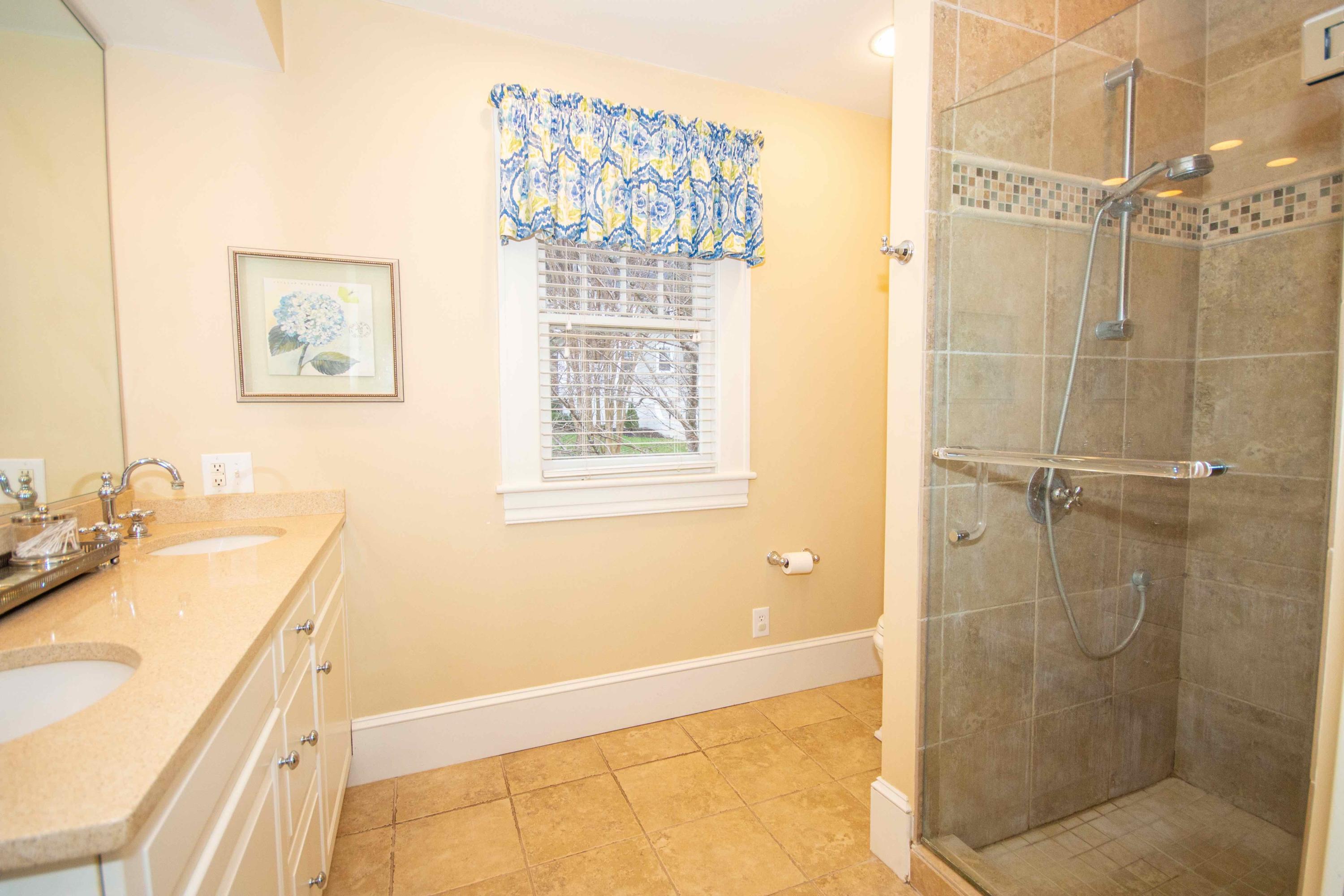 2743 Richelieu Avenue Southwest Roanoke, VA 24014 - Photo 43 of 54 a bathroom with a sink and a mirror