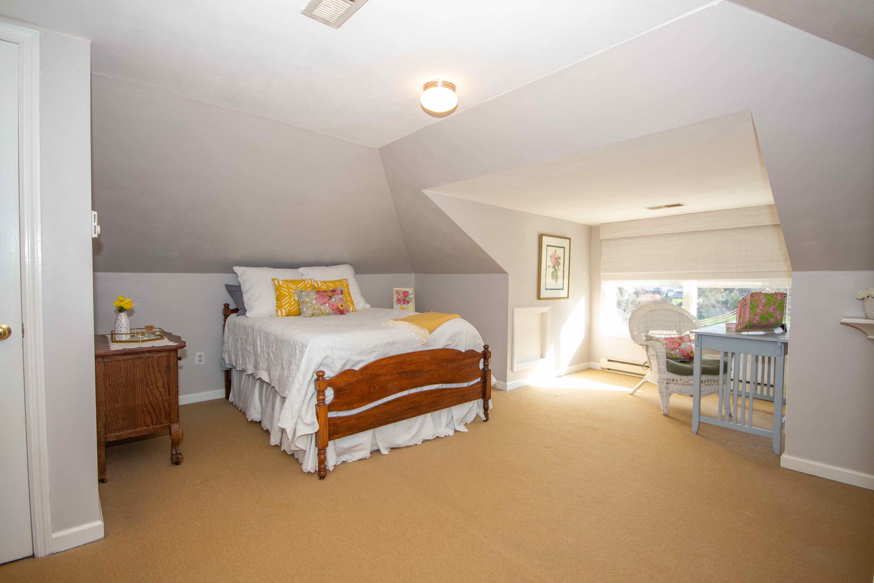 2743 Richelieu Avenue Southwest Roanoke, VA 24014 - Photo 44 of 54 a bedroom with a bed and chair