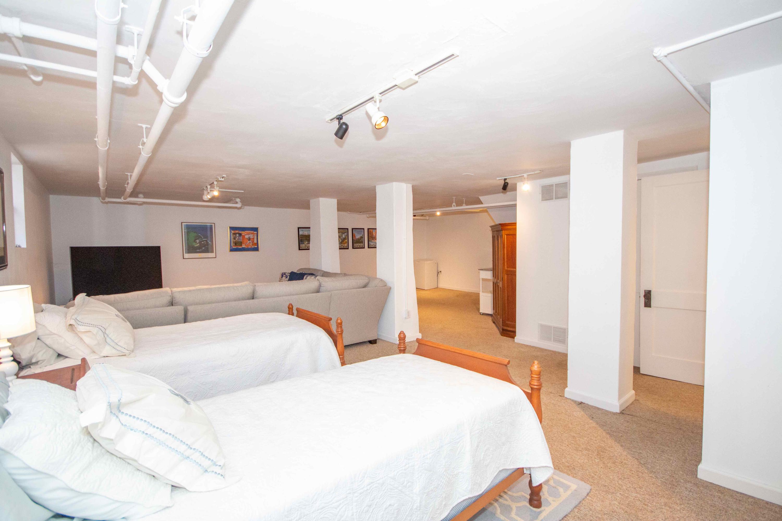 2743 Richelieu Avenue Southwest Roanoke, VA 24014 - Photo 51 of 54 a large bedroom with a bed and ceiling fan