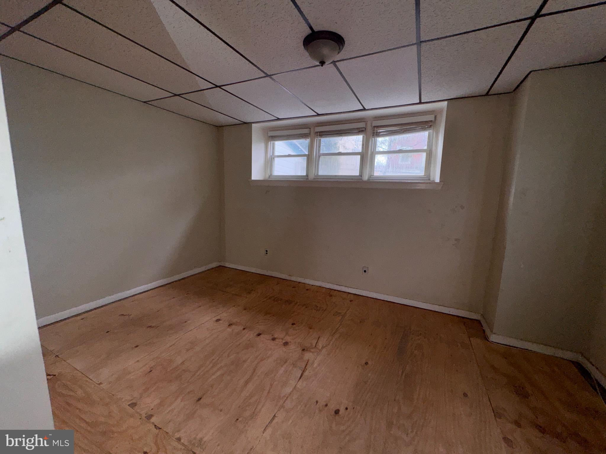 813 North 64th Street Philadelphia, PA 19151 - Photo 11 of 23 a view of a big room with wooden floor and windows