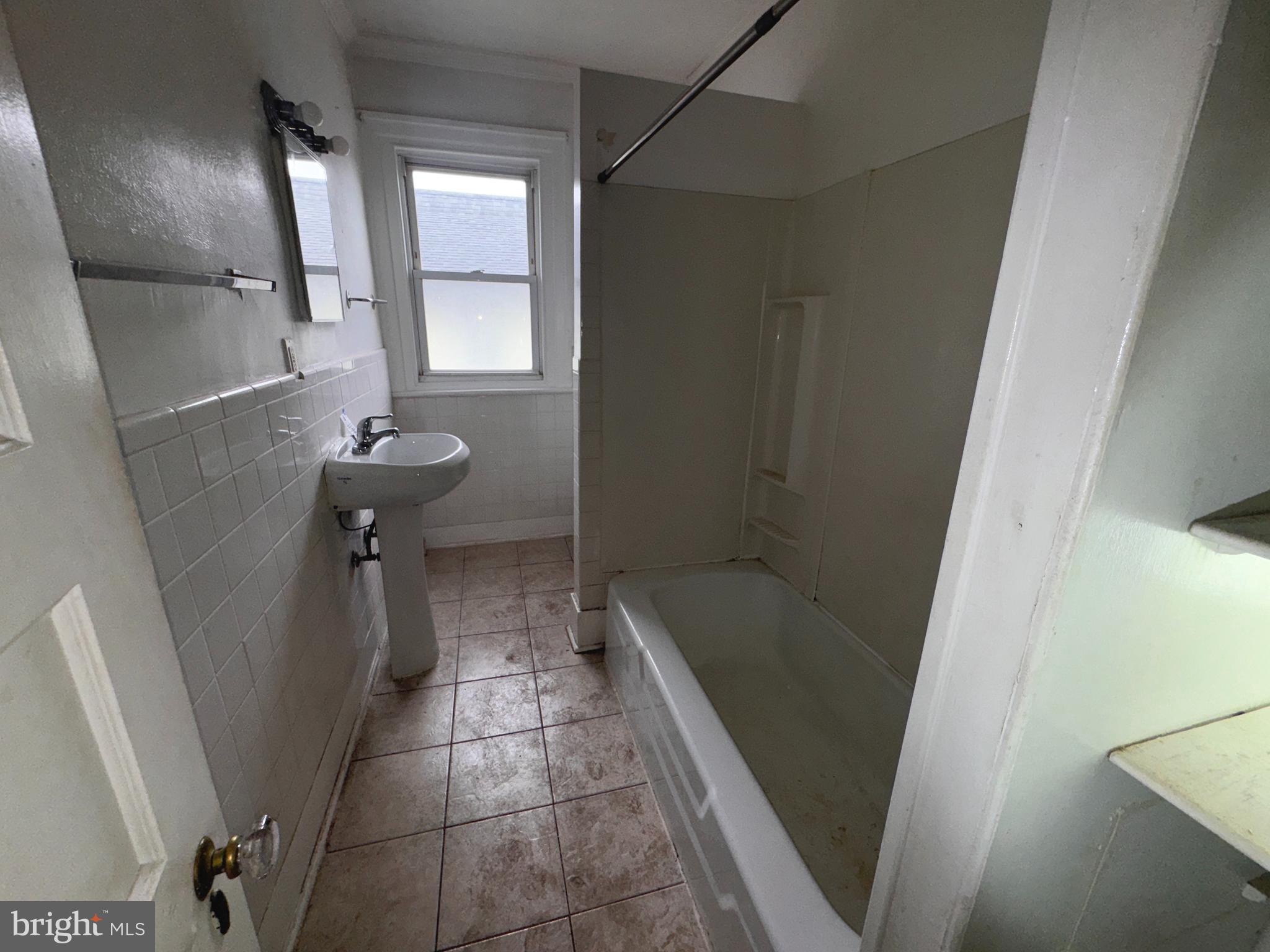 813 North 64th Street Philadelphia, PA 19151 - Photo 19 of 23 a bathroom with a sink and tub