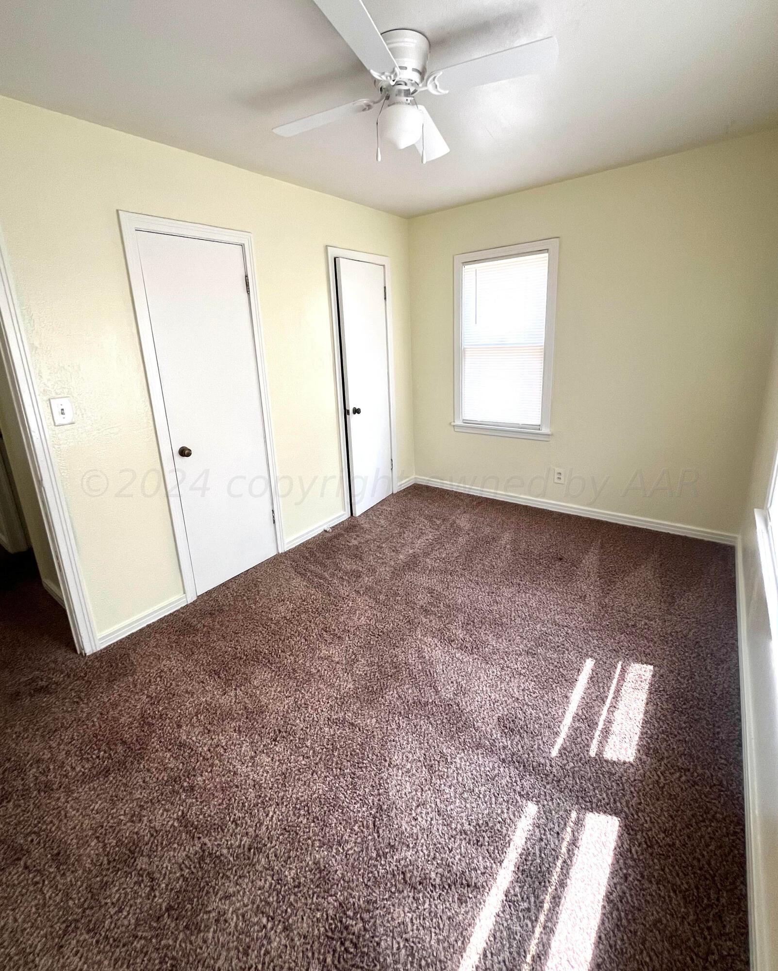 3611 South Travis Street Amarillo, TX 79110 - Photo 12 of 20 Front bedroom with 2 closets