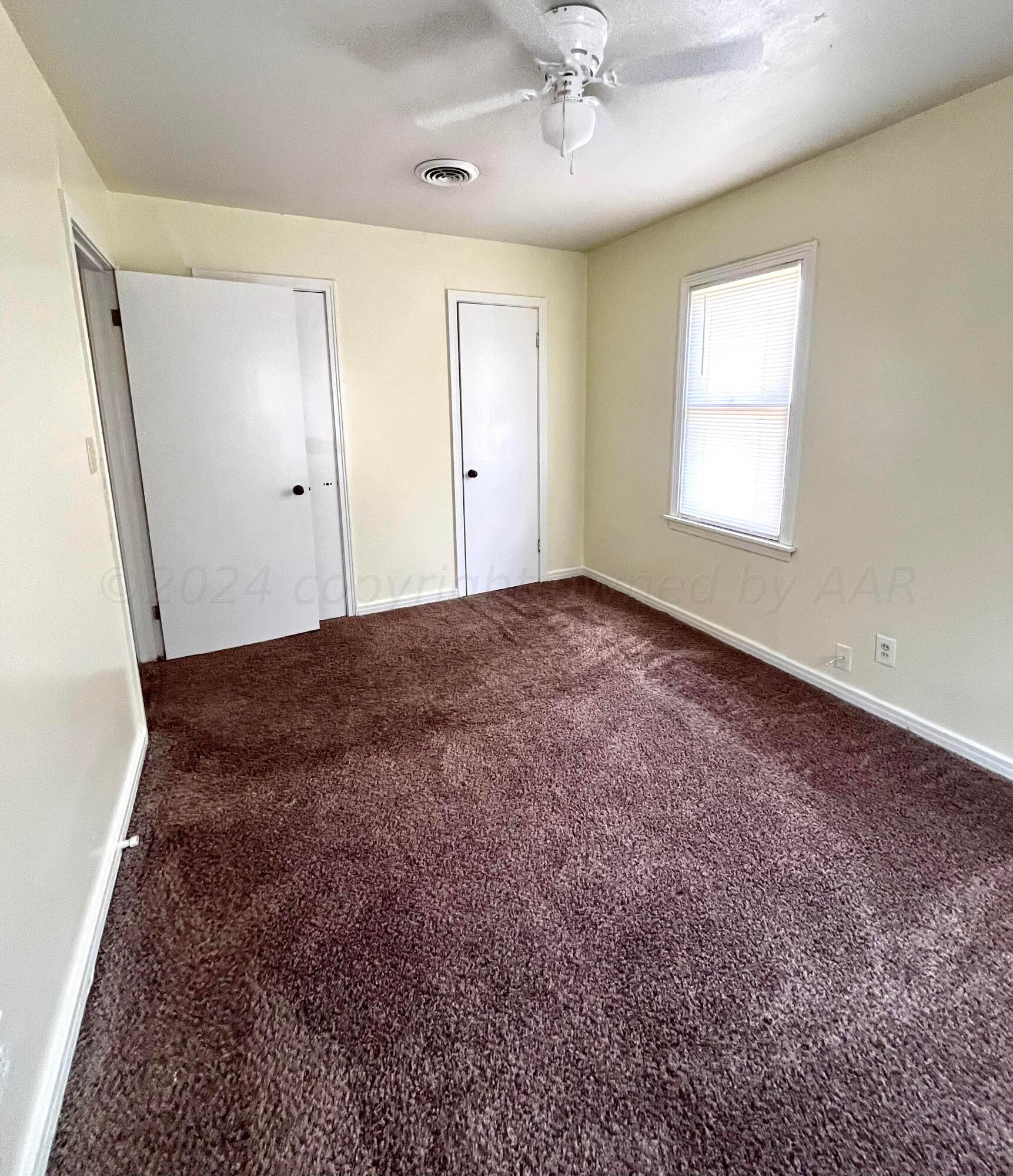 3611 South Travis Street Amarillo, TX 79110 - Photo 15 of 20 Back bedroom with 2 closets