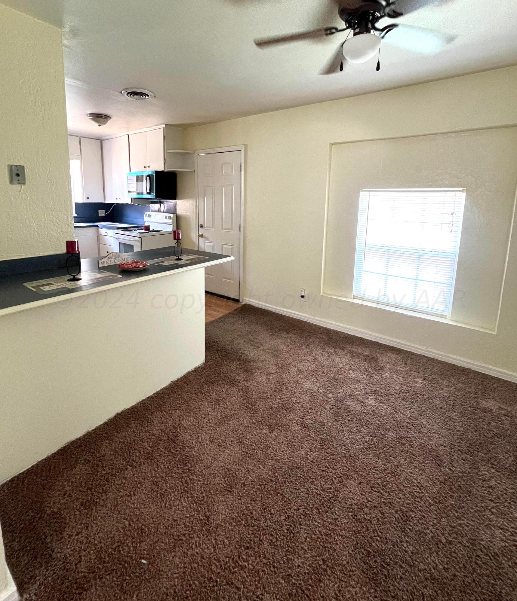 3611 South Travis Street Amarillo, TX 79110 - Photo 7 of 20 Dining to kitchen