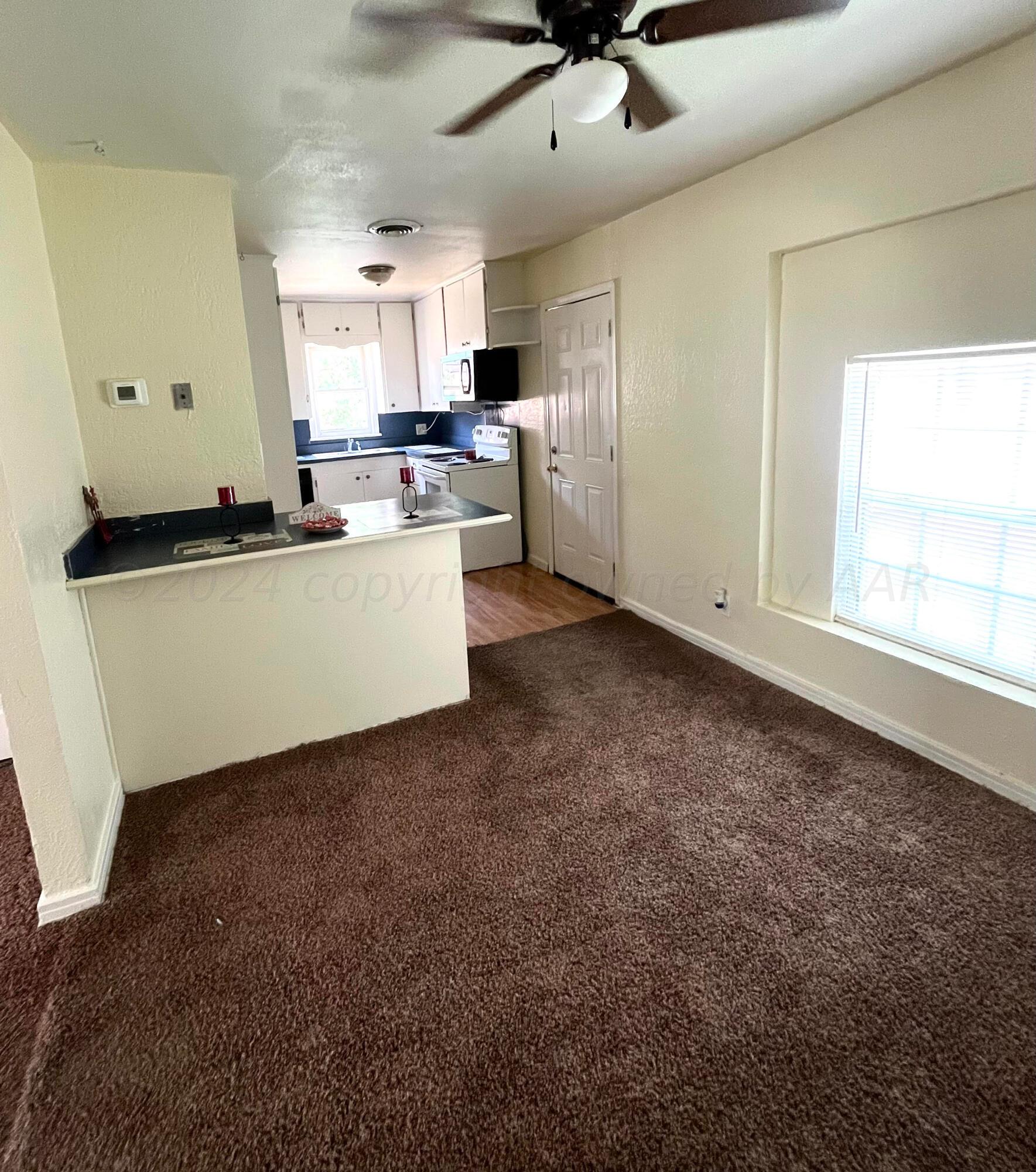 3611 South Travis Street Amarillo, TX 79110 - Photo 8 of 20 Dining room to kitchen view