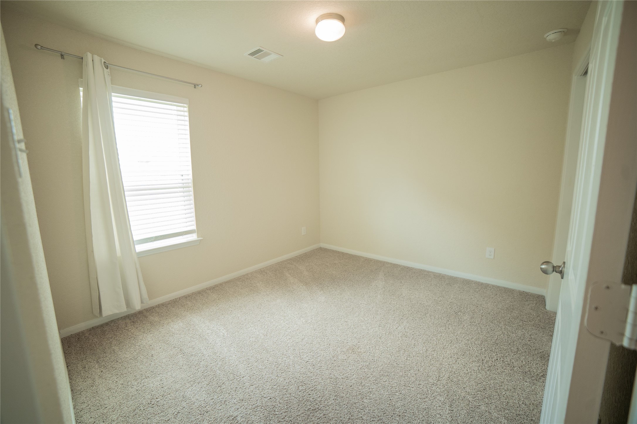 3006 Tandem Court Rosenberg, TX 77471 - Photo 19 of 33 an empty room with a window