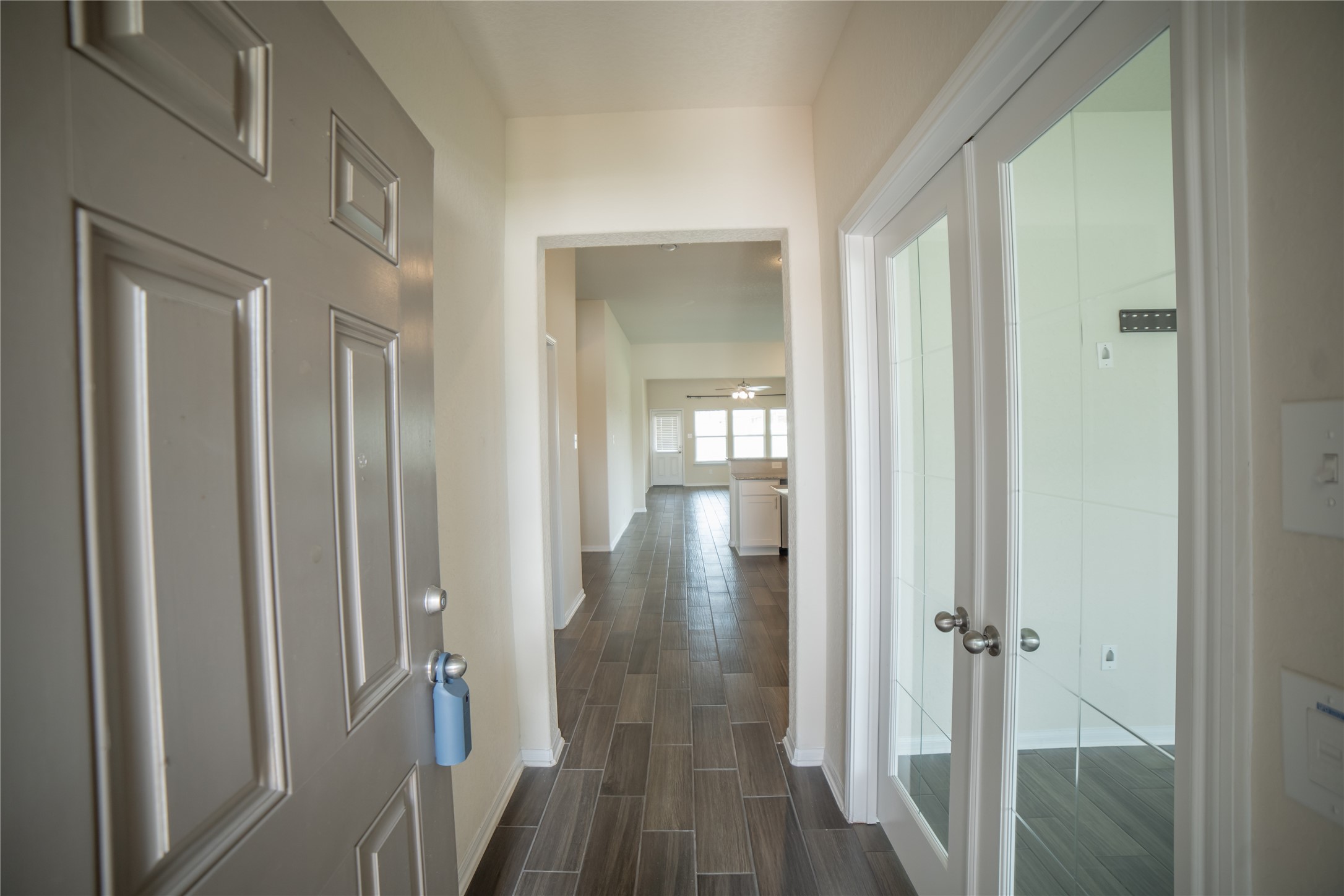 3006 Tandem Court Rosenberg, TX 77471 - Photo 4 of 33 a view of a hallway with a wooden floor