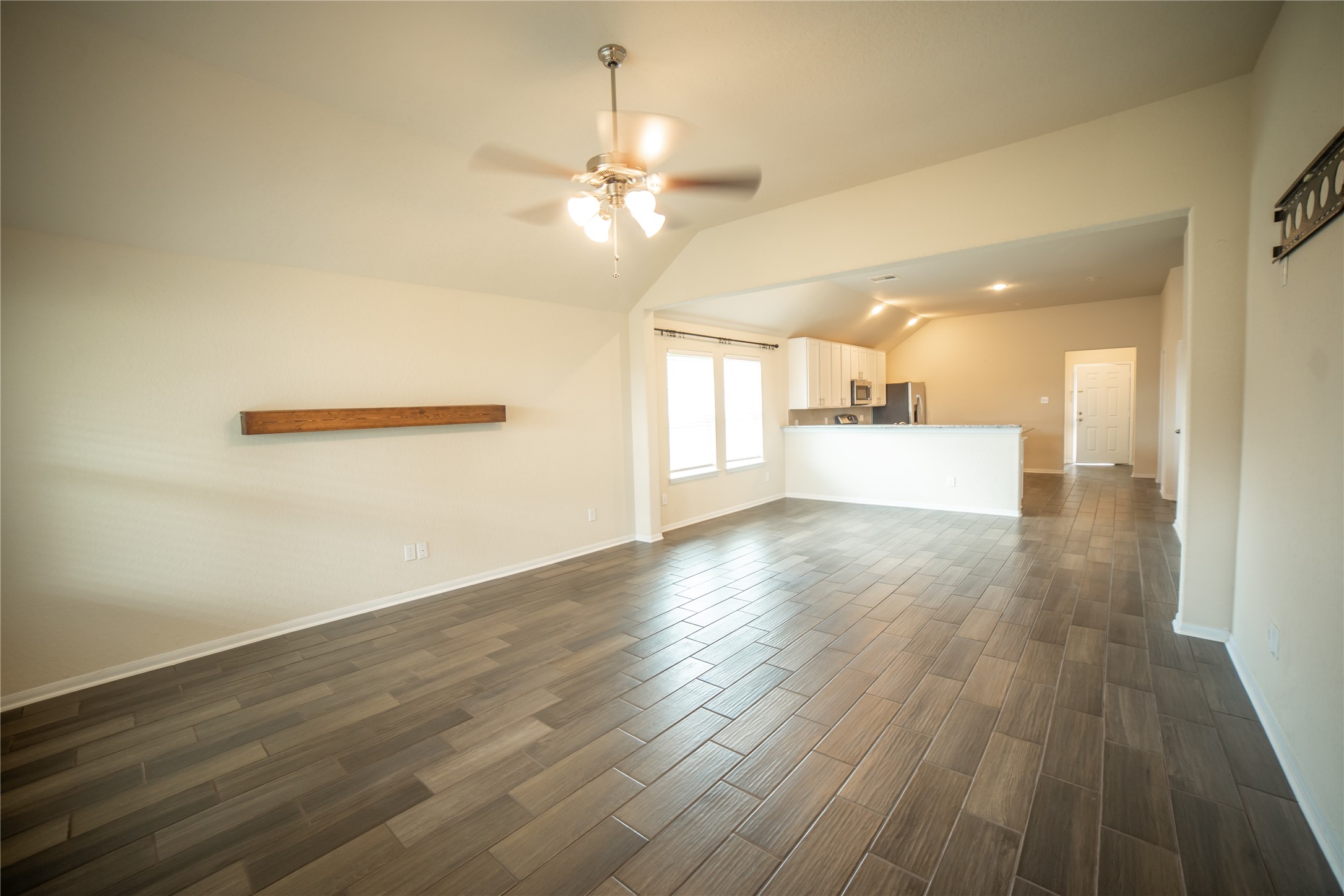 3006 Tandem Court Rosenberg, TX 77471 - Photo 7 of 33 a view of a room with wooden floor and window
