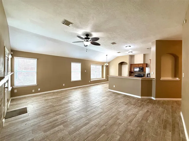 a view of a kitchen with a sink and a window